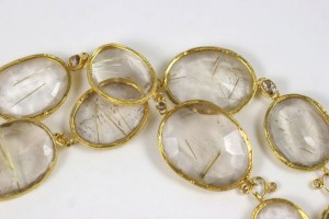 A close up of the gold and clear stones
