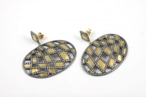 A pair of diamond and gold earrings.