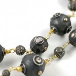 A close up of the beads on a necklace