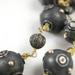 A close up of the beads on a necklace