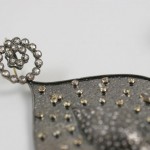 A close up of the back of a purse