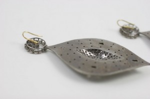 A close up of the metal piece on the necklace
