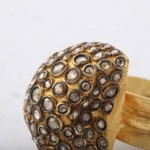 A close up of the top part of a gold ring