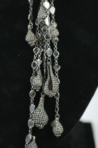 A black velvet necklace with silver and crystal beads.
