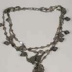 A necklace with many different shapes and sizes.