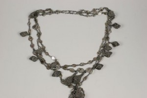 A necklace with many different shapes and sizes.