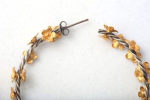 A pair of scissors and some gold flowers