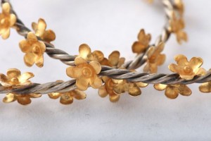 A close up of the flowers on a bracelet