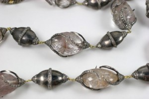 A close up of the necklace on the table