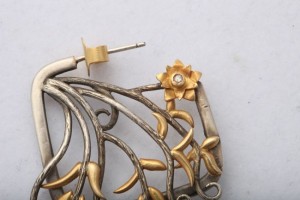 A close up of the ear piece of a pair of earrings