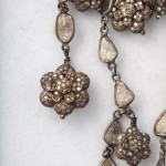 A close up of the necklace on display.