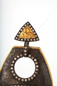 A close up of the top part of a necklace