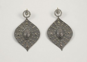 A pair of earrings with diamonds on them.