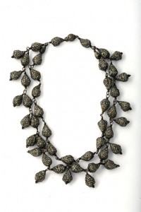 A necklace with many small beads on it