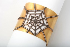 A close up of the top part of a cuff bracelet