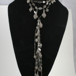 A black velvet display with a necklace on it