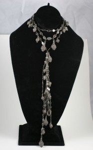 A black velvet display with a necklace on it