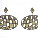 A pair of earrings with diamonds and gold.