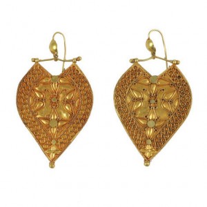 A pair of gold earrings with a heart shaped design.