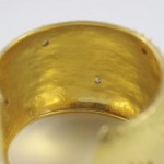 A close up of the inside of a gold ring