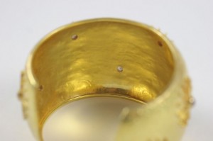 A close up of the inside of a gold ring