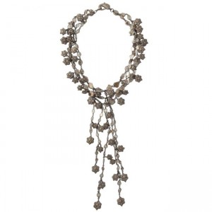 A long necklace with silver beads and chains.