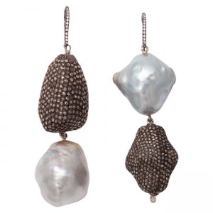 A pair of earrings with pearls and diamonds.