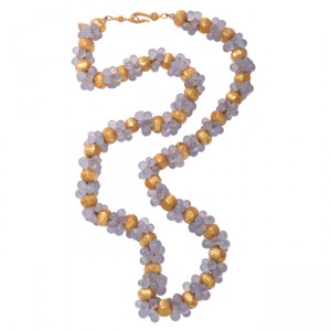 A long necklace with gold and blue beads