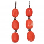 A pair of coral and diamond earrings