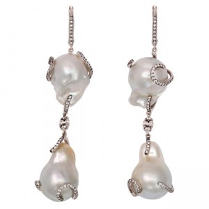A pair of white gold earrings with diamonds and pearls.
