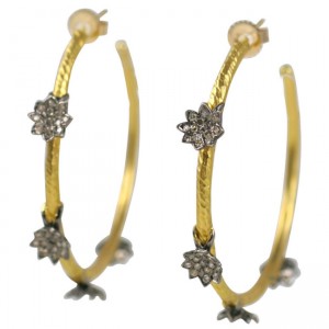 A pair of gold and diamond hoop earrings.