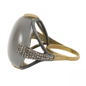 A ring with a large gray stone and small black stones.