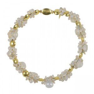 A gold and white bracelet with pearls