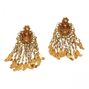 A pair of gold earrings with dangling chains.