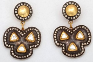 A pair of earrings with gold and diamond accents.