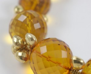A close up of the beads on a necklace
