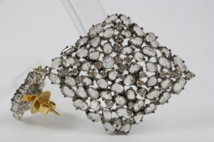 A close up of a brooch on a table