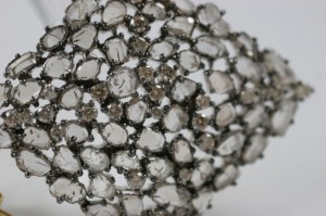 A close up of the top of a brooch