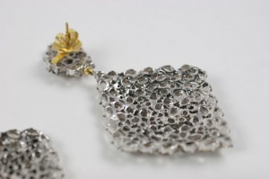 A close up of the earrings on a table