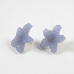 A pair of earrings made out of plastic.