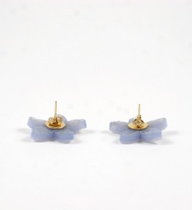 A pair of earrings made out of plastic.
