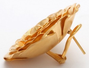 A gold object is sitting on top of a table.