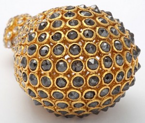 A close up of the gold and black diamond ball