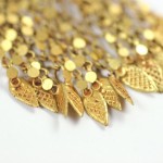 A close up of the gold leaf design on the necklace.