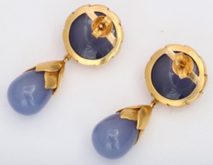 A pair of earrings with blue chalcedony and gold.