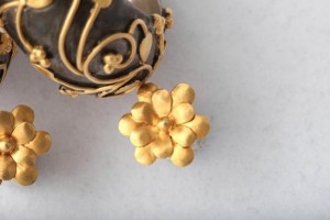 A close up of the top of a gold flower
