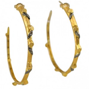 A pair of gold hoop earrings with black diamonds.