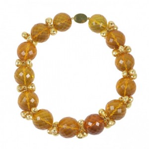 A necklace of amber colored beads and gold plated spacers.