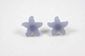A pair of frosted glass flower earrings.