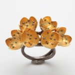 A ring with gold flowers on it.